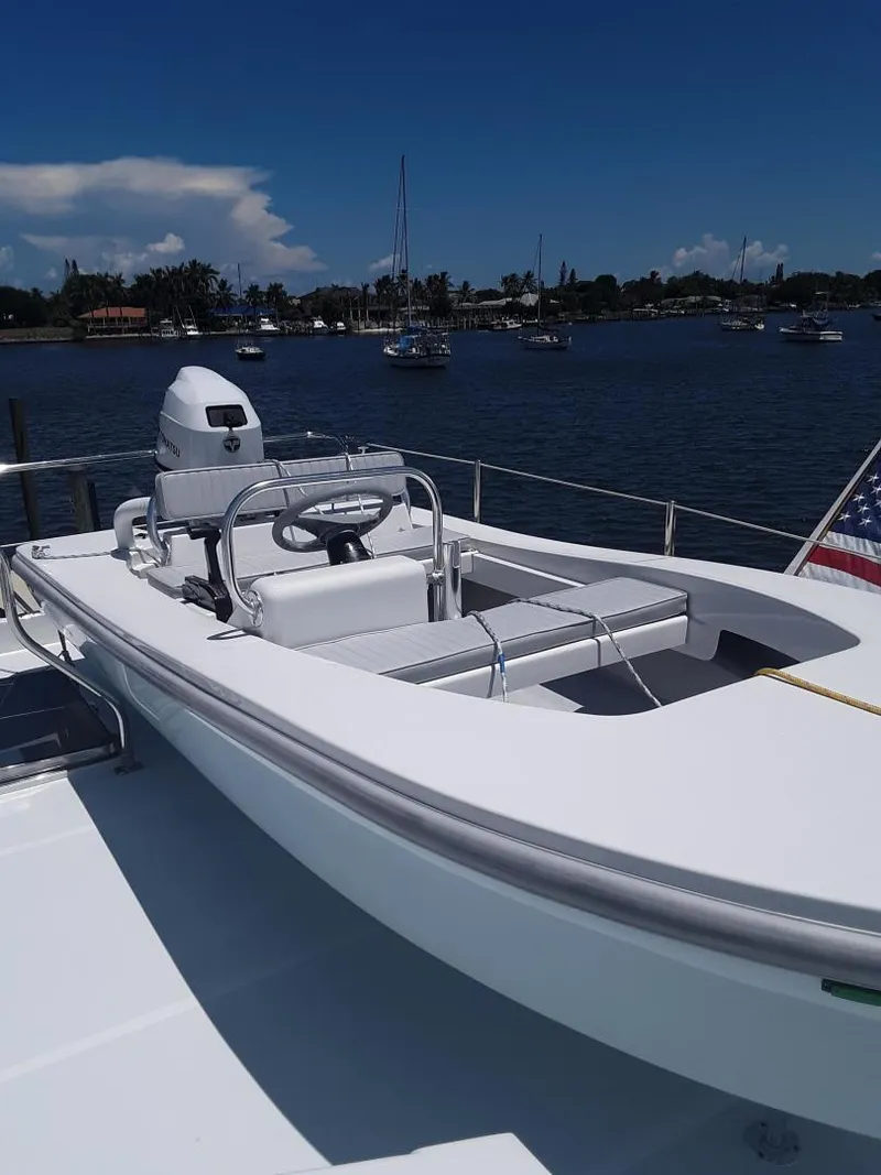 The Image of 2024 Ultra Lite Tenders Rigged 380 boat docked on a sunny day. - 1
