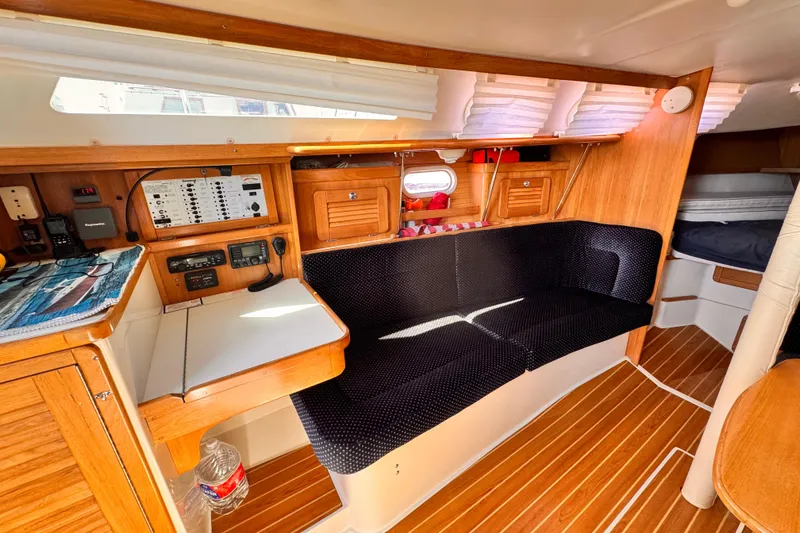 Slide: The Image of Interior of a 2006 Catalina 34 MkII sailboat with wood finish and navigation station. - 5