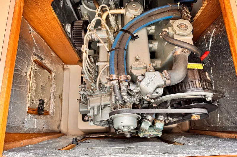 Slide: The Image of Engine compartment of a 2006 Catalina 34 MkII sailboat, showcasing detailed mechanical components. - 10
