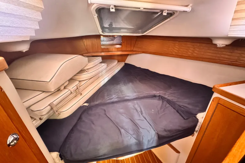 Slide: The Image of Cozy cabin interior of 2006 Catalina 34 MkII sailboat with cushions and wooden accents. - 6