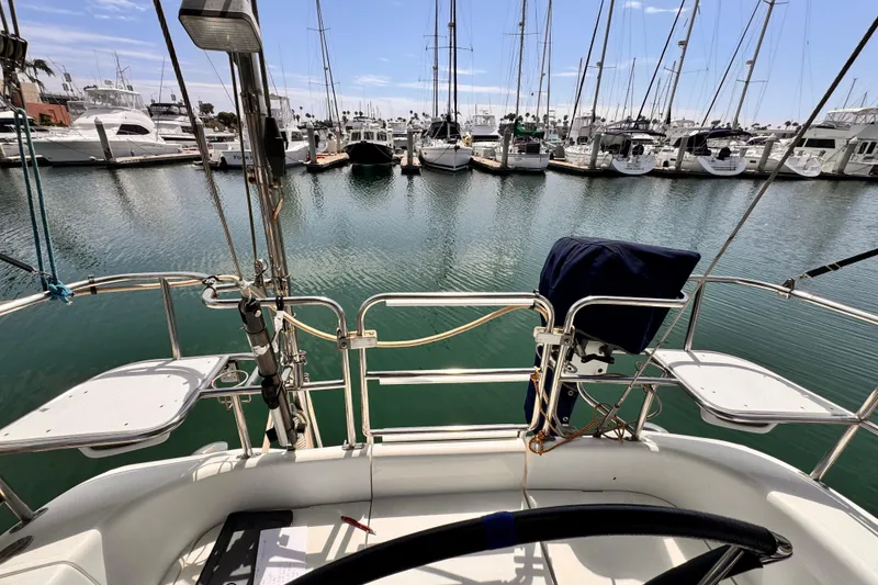 Slide: The Image of View from a 2006 Catalina 34 MkII sailboat cockpit in a marina. - 6