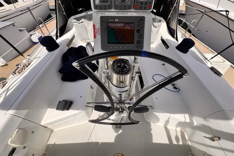 Slide: The Image of Cockpit of 2006 Catalina 34 MkII sailboat with navigation equipment and steering wheel. - 3