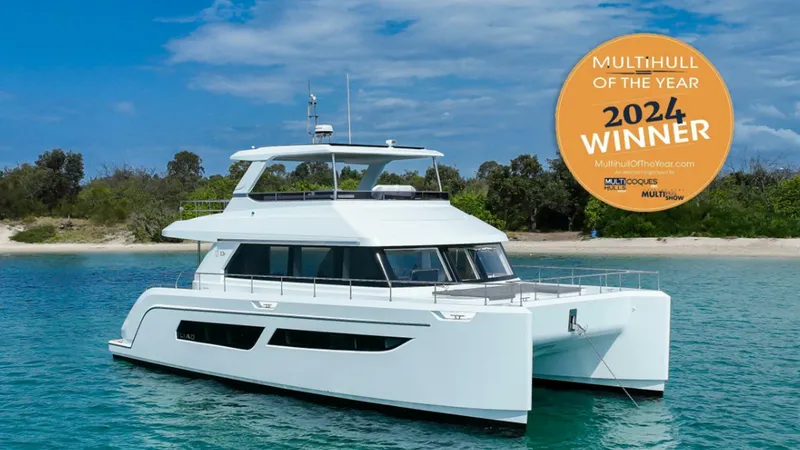 Slide: The Image of Luxury ILIAD 53F yacht, 2024 Multihull of the Year winner, cruising in clear waters. - 41