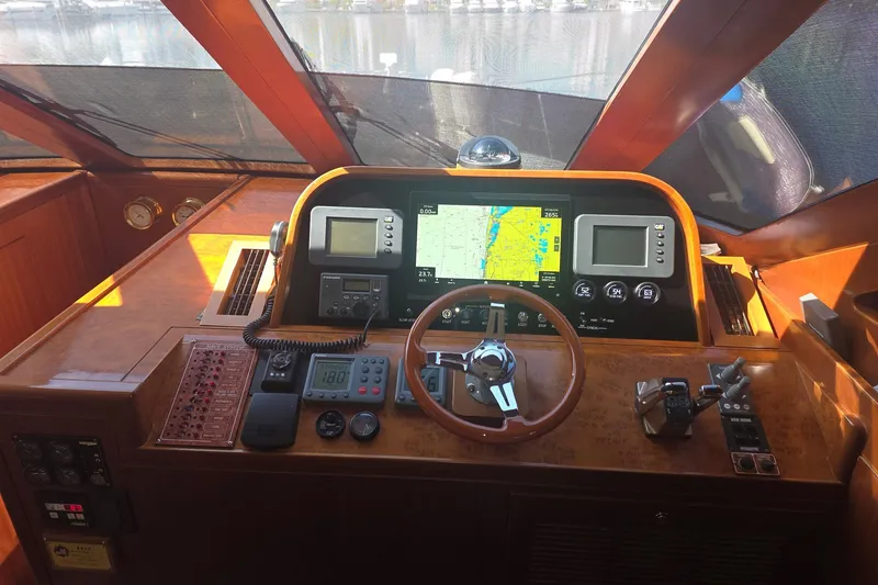 Slide: The Image of Cockpit of 2009 Grand Harbour 66 Motoryacht with navigation equipment and steering wheel. - 39