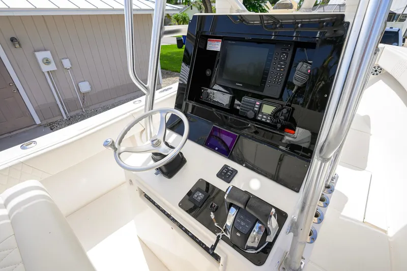 Slide: The Image of 2007 Competition 25 boat console with steering wheel, navigation equipment, and control panel. - 21