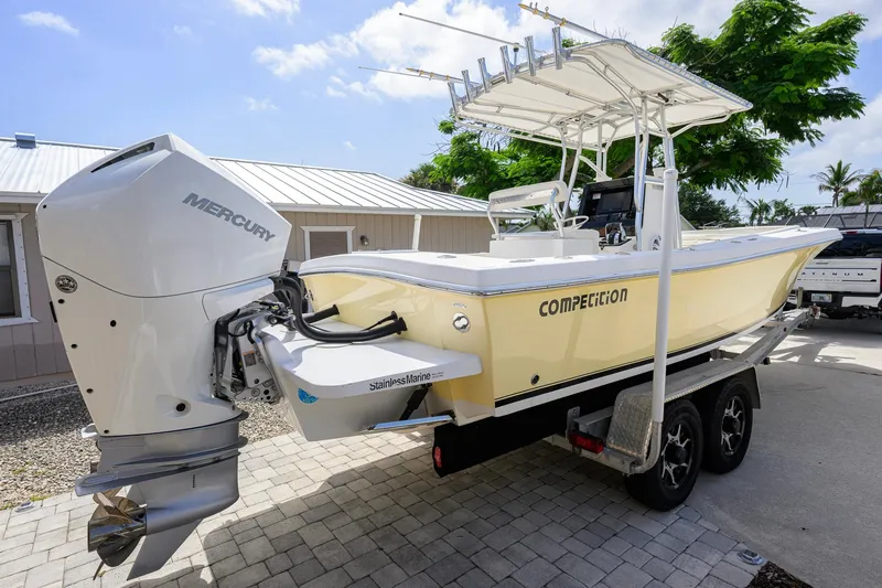 Slide: The Image of 2007 Competition 25 boat with Mercury engine on trailer, parked outdoors. - 9