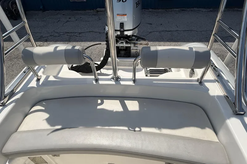 Slide: The Image of 2014 Marlago 520CC boat interior with cushioned seating and Honda outboard motor. - 11