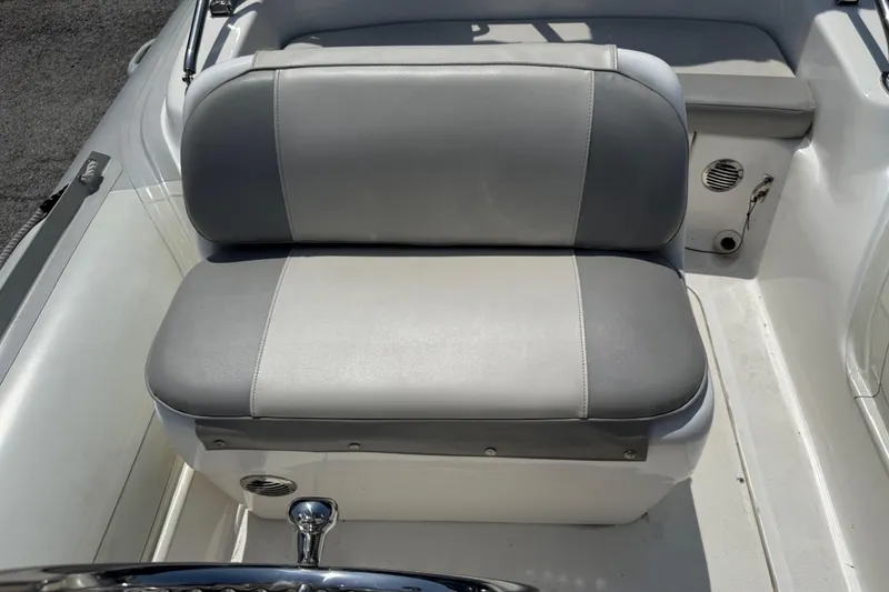 Slide: The Image of 2014 Marlago 520CC boat seat with gray upholstery and white accents. - 10