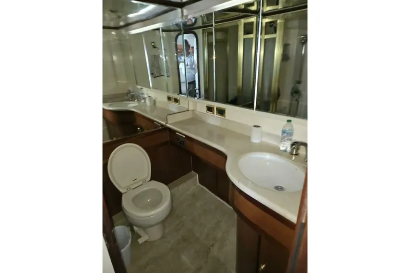 Slide: The Image of Luxurious yacht bathroom with mirror, sink, and toilet, Johnson FLY 2003 model. - 27