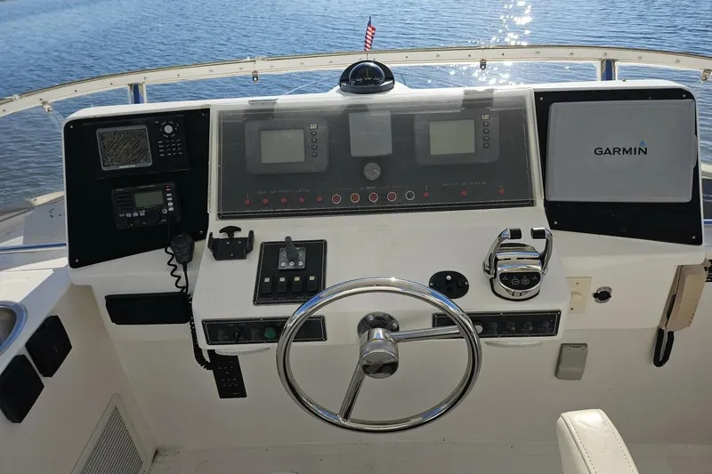 Slide: The Image of Control panel of a 2003 Johnson FLY boat with Garmin navigation system. - 10