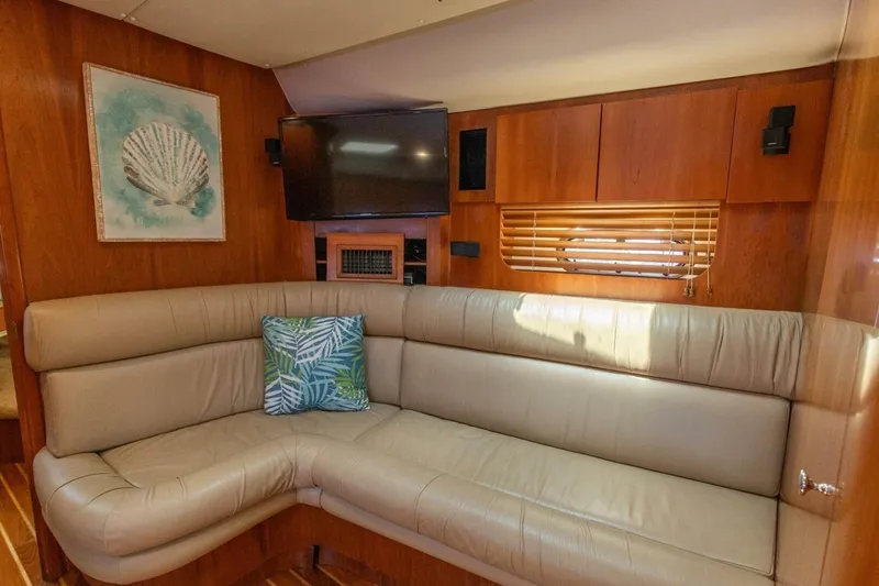 Slide: The Image of Luxurious interior of 2000 Tiara Yachts 5200 Express with leather seating and nautical decor. - 15