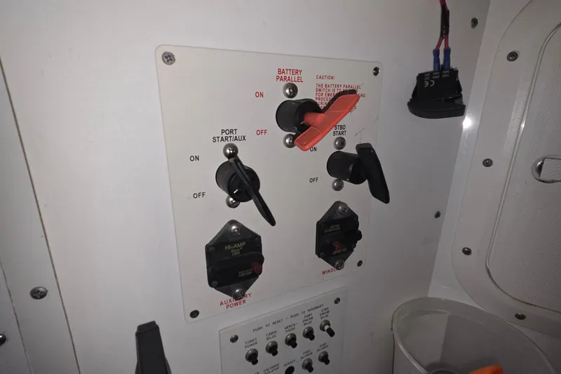 Slide: The Image of Control panel of a 2004 Formula 370 Super Sport boat with switches and labels. - 25