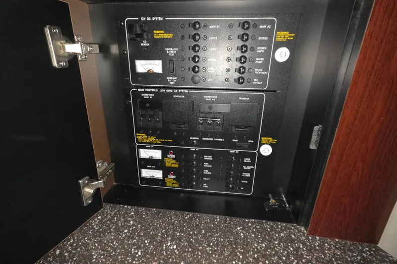 Slide: The Image of Electrical control panel inside a 2004 Formula 370 Super Sport boat. - 14