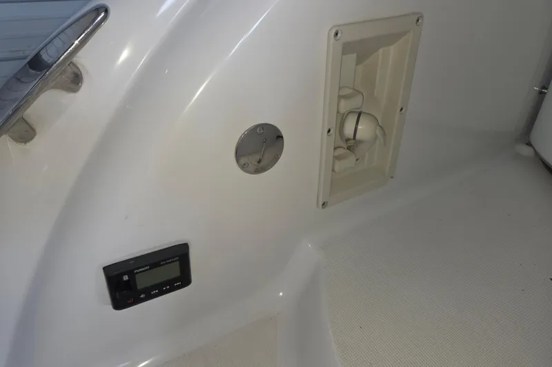 Slide: The Image of 2004 Formula 370 Super Sport boat interior with control panel and fixtures. - 27