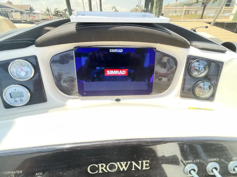 Slide: The Image of Dashboard of a 2015 Harris FloteBote Crown DL 250 with Simrad screen and gauges. - 31
