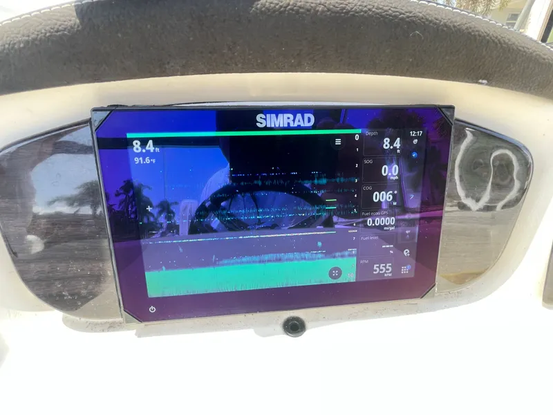 Slide: The Image of A Simrad screen on a boat displays navigation and depth information. - 35