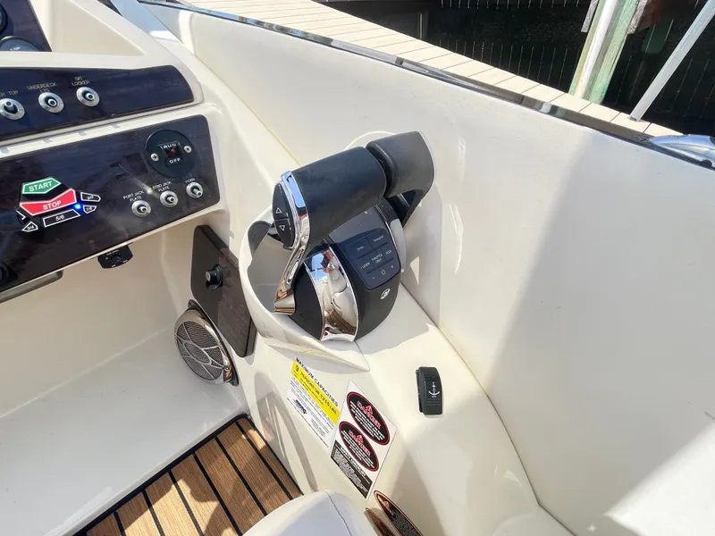 Slide: The Image of The image shows the helm of a 2015 Harris FloteBote Crown DL 250 with controls and gauges. - 40