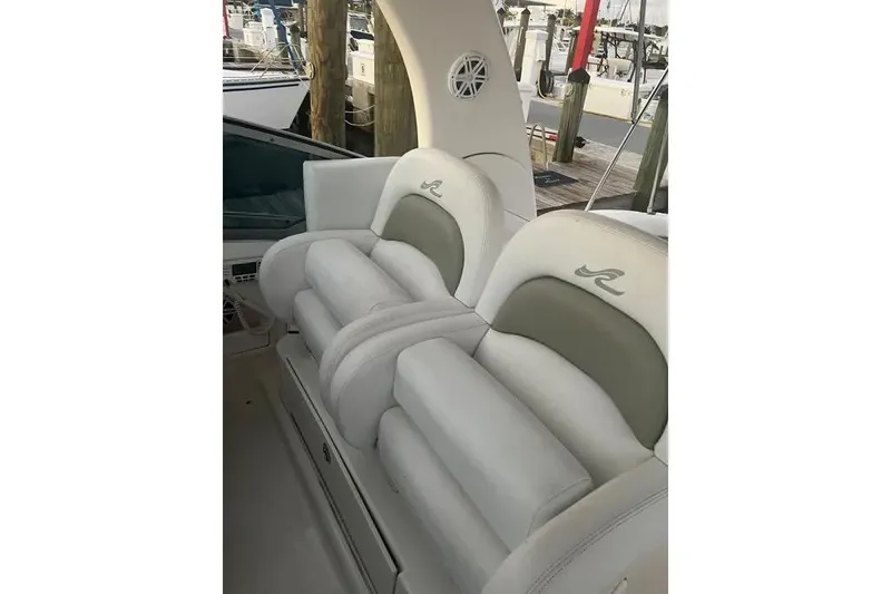 Slide: The Image of Luxury seating on a 2006 Sea Ray 340 Sundancer yacht at a marina. - 4