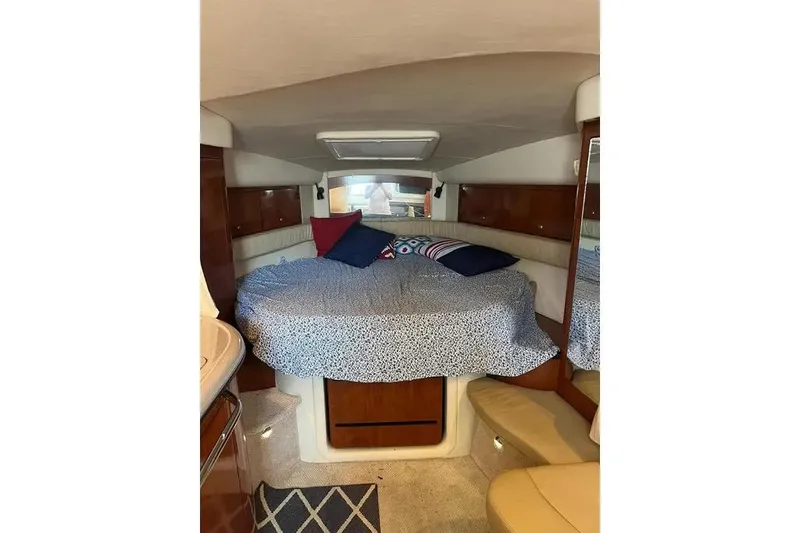 Slide: The Image of Interior cabin of 2006 Sea Ray 340 Sundancer with cozy bed and pillows. - 12