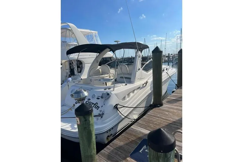 Slide: The Image of 2006 Sea Ray 340 Sundancer docked at marina under clear blue sky. - 0