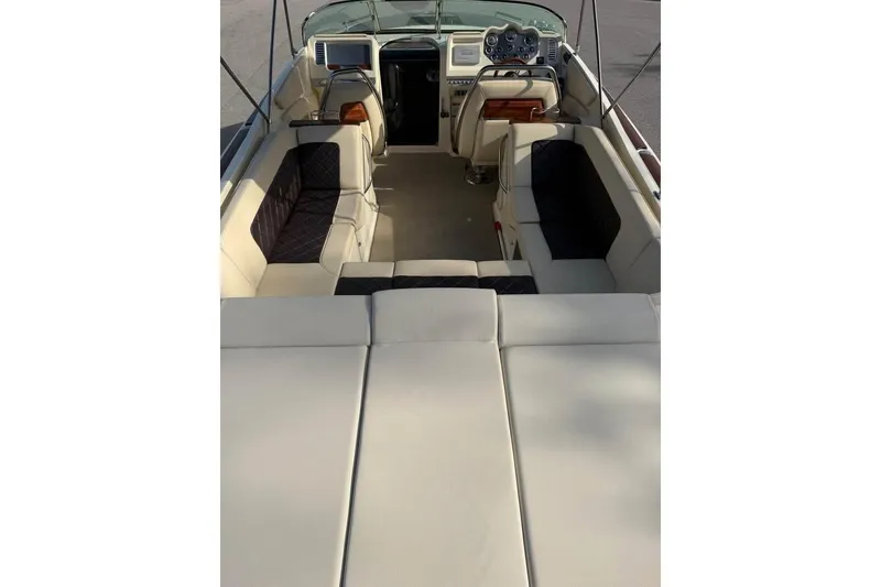 Slide: The Image of 2018 Chris-Craft Corsair 30 interior with luxurious seating and modern dashboard. - 10