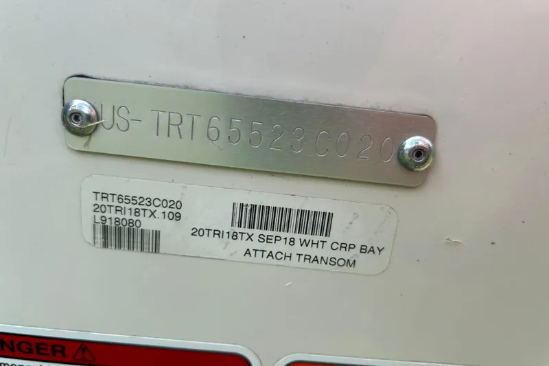 Slide: The Image of 2020 Triton 18 TX boat identification plate with serial numbers and barcode. - 17