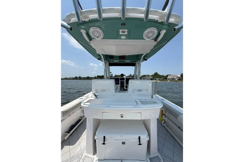 Slide: The Image of 2015 Everglades 295 Center Console boat interior with fishing station and ocean view. - 15