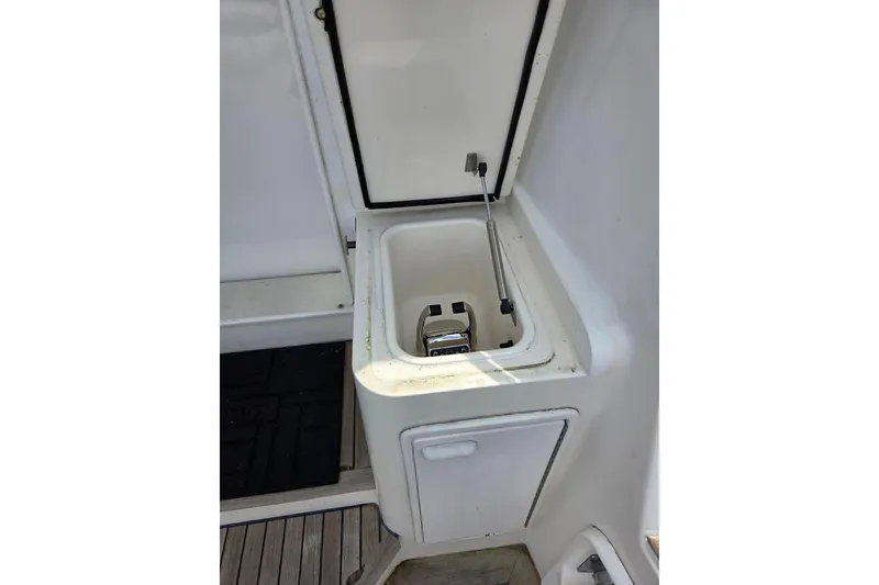 Slide: The Image of Open storage compartment on 2002 Ocean 56 Super Sport yacht deck. - 29