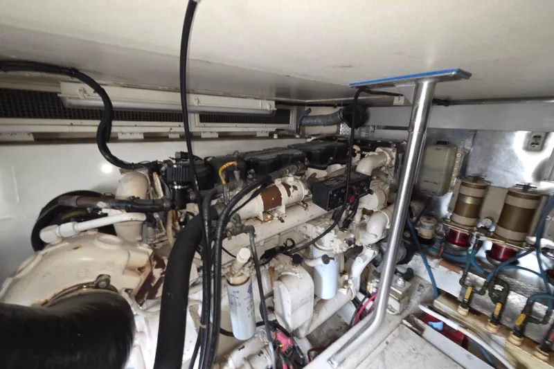 Slide: The Image of Engine room of 2002 Ocean 56 Super Sport yacht, showcasing mechanical components and systems. - 35