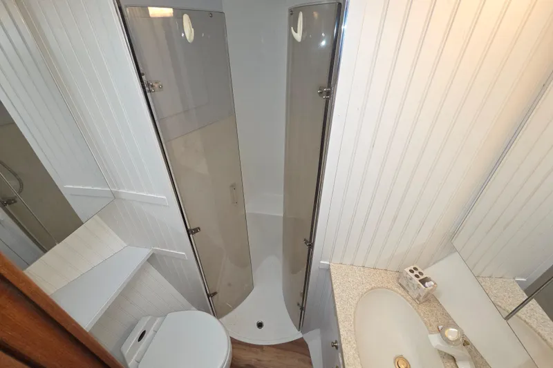 Slide: The Image of Bathroom interior of 2002 Ocean 56 Super Sport yacht with shower and sink. - 23