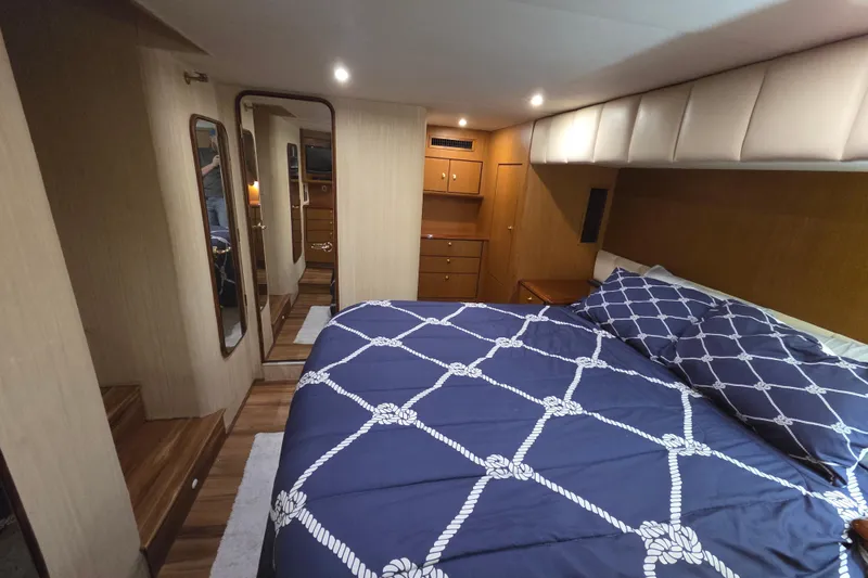 Slide: The Image of Luxurious bedroom interior of 2002 Ocean 56 Super Sport yacht with nautical bedding. - 14
