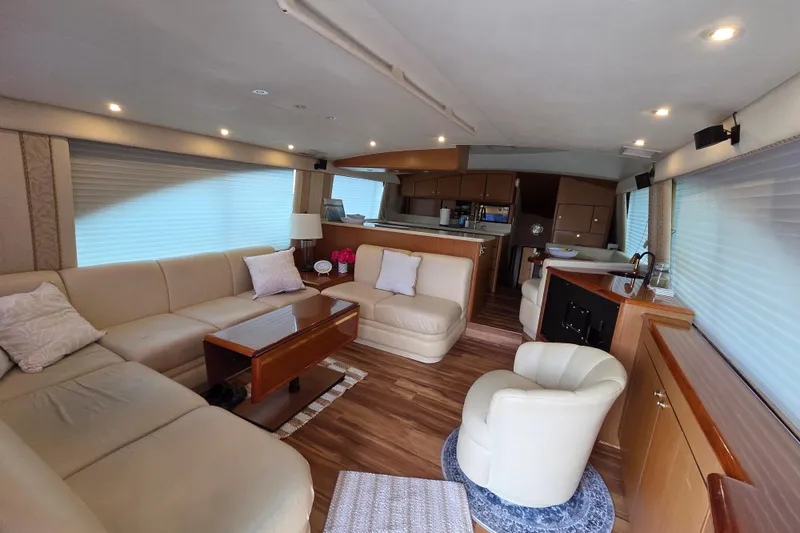 Slide: The Image of Luxurious interior of a 2002 Ocean 56 Super Sport yacht with elegant seating and modern amenities. - 3