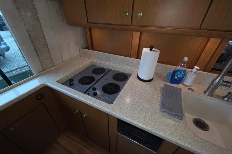 Slide: The Image of Kitchen area of a 2002 Ocean 56 Super Sport yacht with stove and sink. - 7