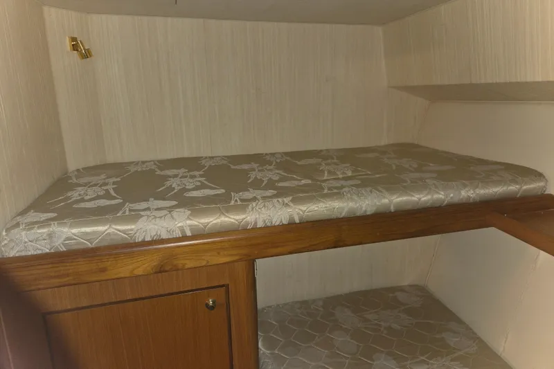 Slide: The Image of Interior cabin of 2002 Ocean 56 Super Sport yacht with patterned bedding. - 18