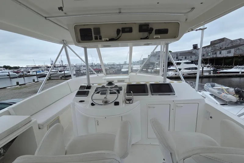 Slide: The Image of Cockpit view of 2002 Ocean 56 Super Sport yacht at marina. - 32