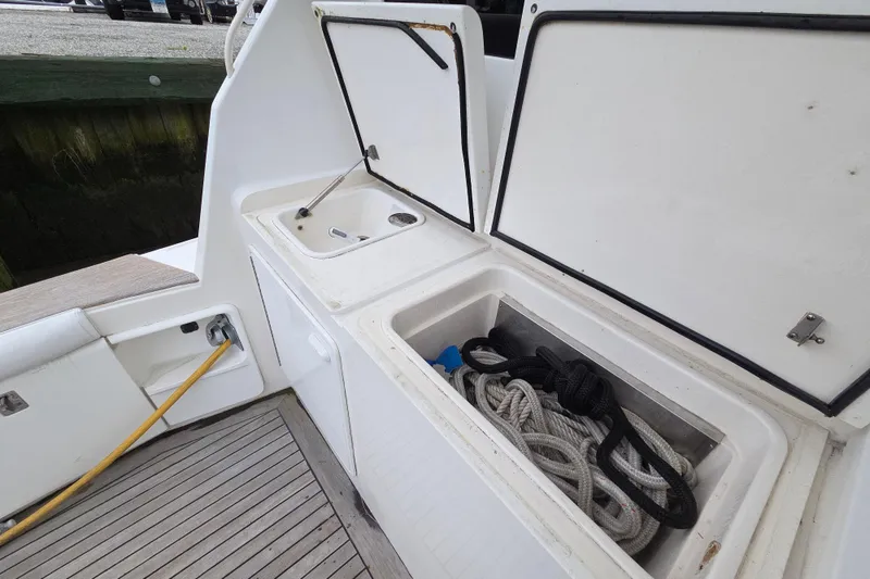Slide: The Image of 2002 Ocean 56 Super Sport yacht deck with storage and sink area. - 28