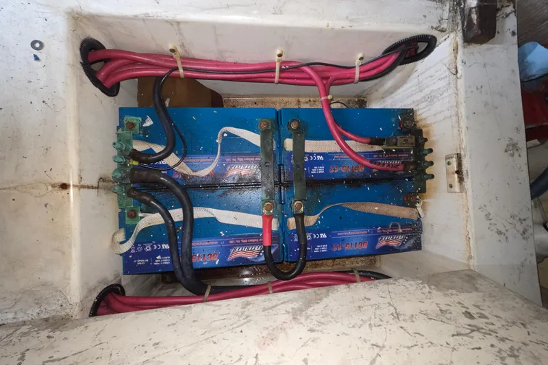 Slide: The Image of Battery compartment of a 2002 Ocean 56 Super Sport boat with wiring connections. - 37