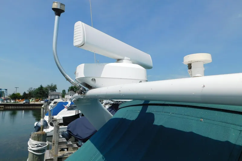 Slide: The Image of Radar equipment on a 1993 Silverton 34 Express boat docked at a marina. - 9