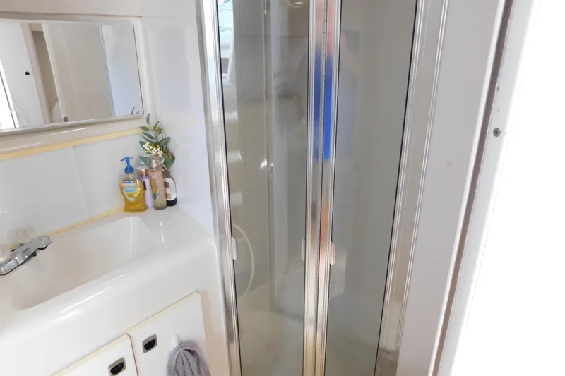 Slide: The Image of Bathroom interior of 1993 Silverton 34 Express yacht with shower and sink. - 67