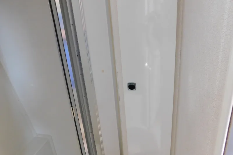 Slide: The Image of Interior view of a 1993 Silverton 34 Express boat, featuring a sleek white door. - 72