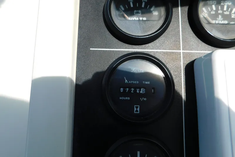 Slide: The Image of Dashboard gauges of a 1993 Silverton 34 Express boat, showing elapsed time. - 22