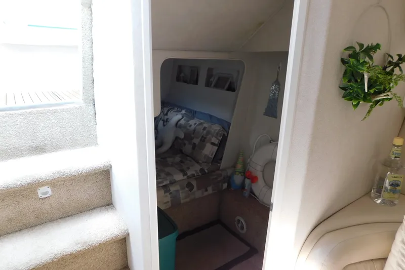 Slide: The Image of Interior of 1993 Silverton 34 Express boat with cozy seating and decorative elements. - 60