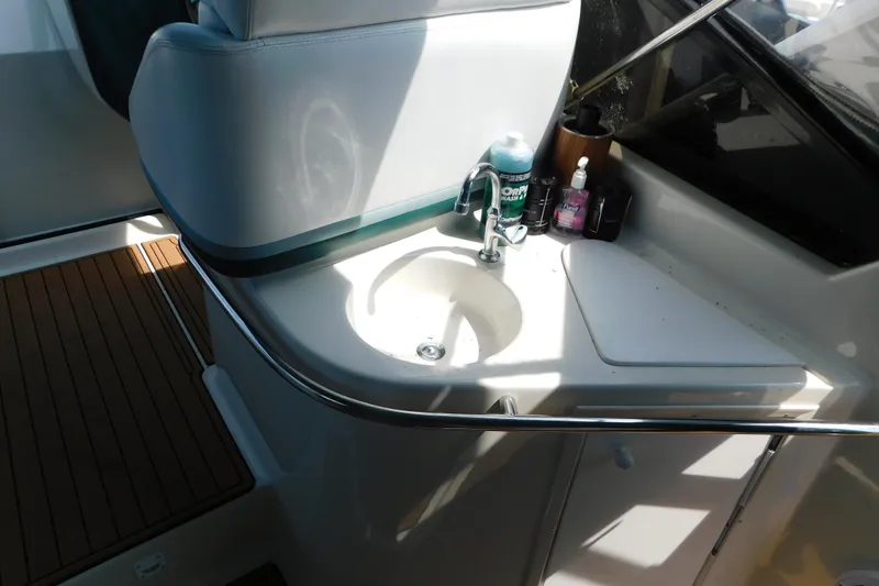 Slide: The Image of 1993 Silverton 34 Express yacht interior with sink and countertop amenities. - 16