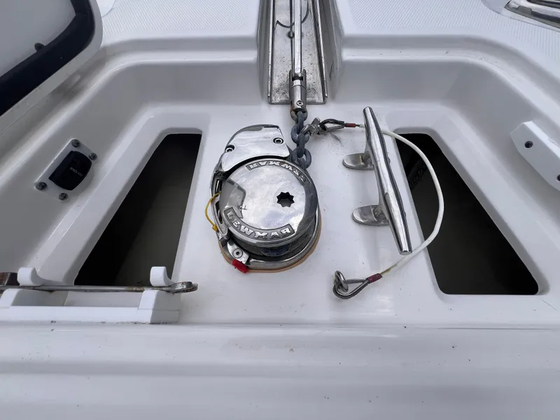 Slide: The Image of The image shows an anchor windlass on a 2021 Edgewater 262CC boat. - 30