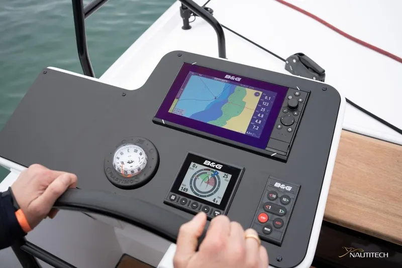 Slide: The Image of Helm of the Nautitech 48 Open with navigation system and compass. - 24