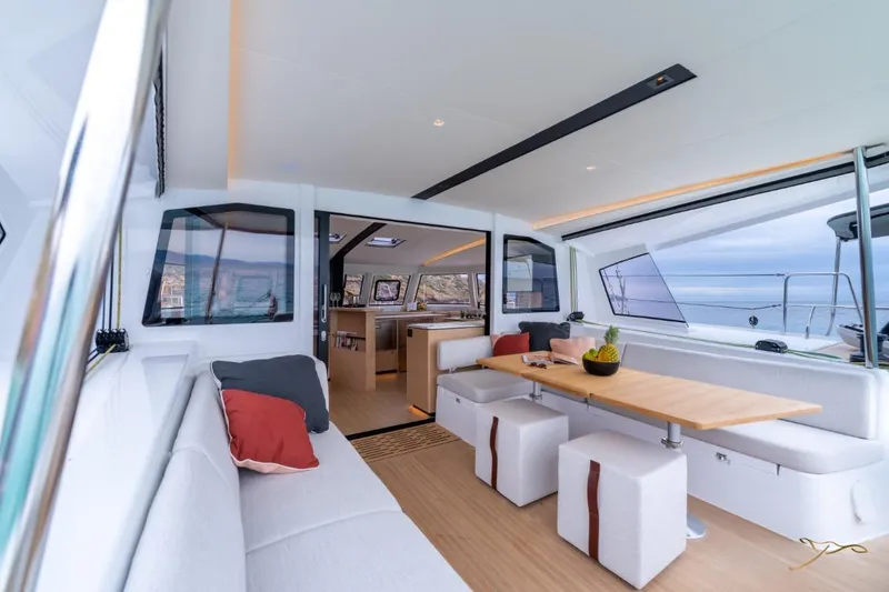 Slide: The Image of Interior of a modern yacht with a stylish dining area and panoramic windows. - 12