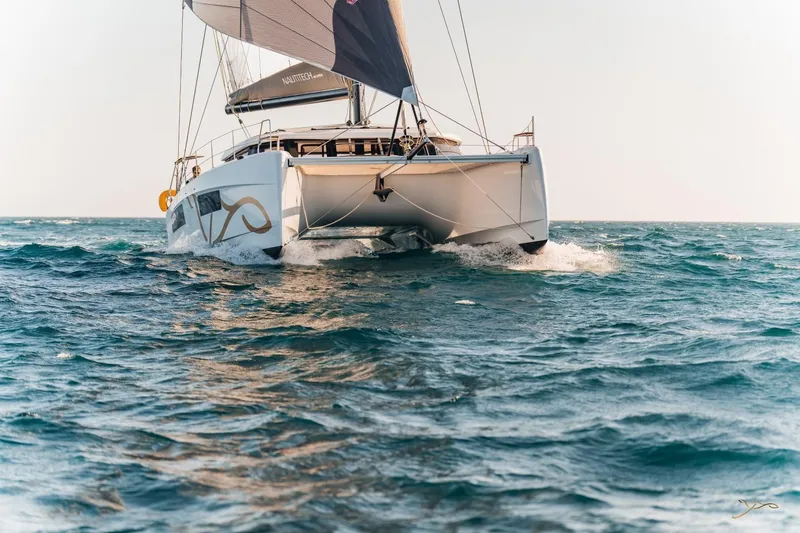 Slide: The Image of Nautitech 44 Open 2027: Sleek catamaran sailing on calm sea with full sails. - 8