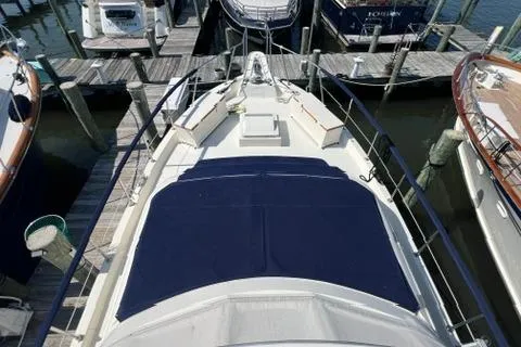 Slide: The Image of 1978 Hatteras 58 Motor Yacht docked, aerial view of deck and surrounding boats. - 38