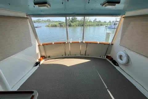 Slide: The Image of 1978 Hatteras 58 Motor Yacht interior with panoramic water view. - 9
