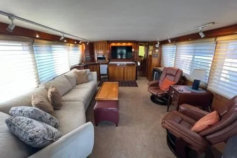 Slide: The Image of 1978 Hatteras 58 Motor Yacht interior with cozy seating and elegant wood finishes. - 42